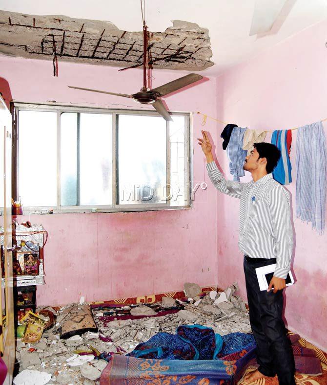 Akhilesh, brother of Abhishek, shows the remains of the ceiling. Pics/Sameer Markande