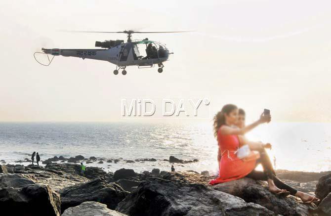 A search was on late into the night for a college girl and a local resident feared to have drowned at Bandra Bandstand on Saturday. Like many others, the girl was taking selfies with her friends when they fell in the water. The rocky terrain at such spots is one of the reasons the fire brigade is unwilling to deploy lifeguards there. Pic/Onkar Devlekar