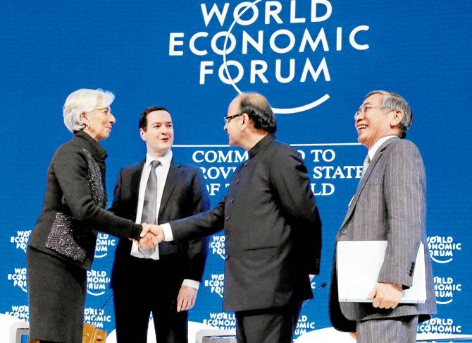 Finance Minister Arun Jaitley shakes hands with Christine Lagarde, Managing Director, IMF during a session at the World Economic Forum in Davos, Switzerland last week. On January 19, the IMF downgraded its forecast for global economic growth. Pic/PTI