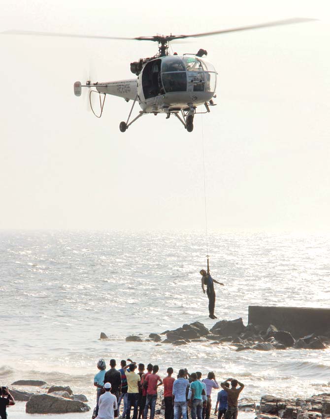 A coast guard helicopter conducts a search operation at Bandra Bandstand on January 9. File pics