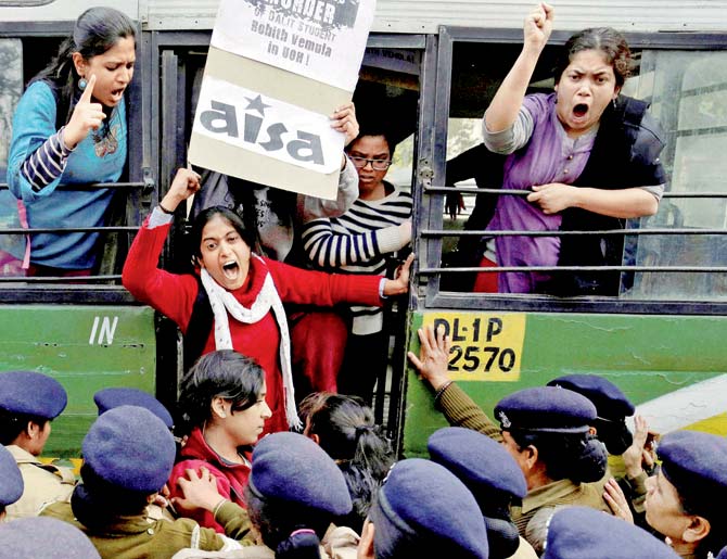 A student shouts slogans demanding resignation of HRD Minister Smriti Irani as they are detained during a protest. PIC/PTI