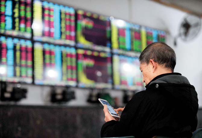 Weak news from China may make 2016 a tough year for Indian markets, but better domestic earnings could help in being bullish here. Pic/AFP Photo China Out