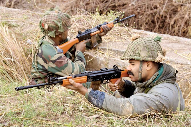 Indian soldiers take position on the perimeter of the Pathankot airforce base. This is the fifth attack since September 2013, following a near identical pattern. Pic/AFP