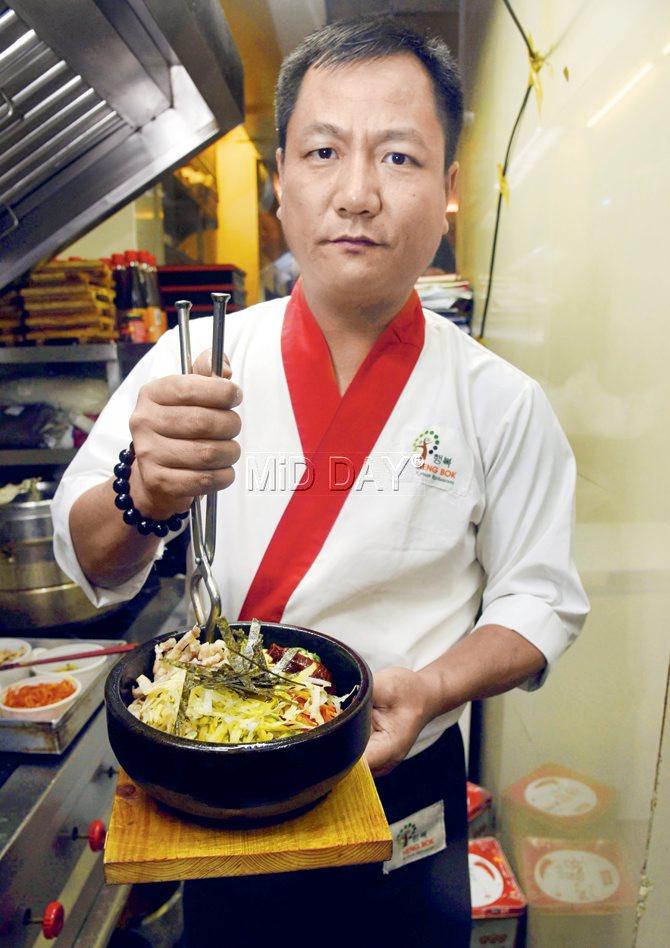 James Biaka, chef at Bandra’s Korean eatery, Hengbok, presenting the bibimbap.  PIC/ATUL KAMBLE