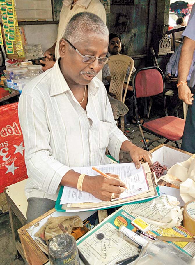 A letter writer in Mumbai.  Pic courtesy/Raj Dabholkar