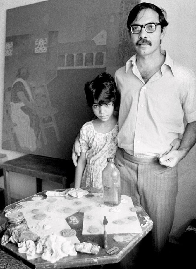 Painter and poet Gieve Patel in his studio with daughter Avaan