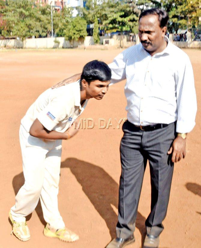 Pranav Dhanawade of KC Gandhi School seeks the blessings of his coach Mobin Shaikh yesterday. Pic/Sameer Markande
