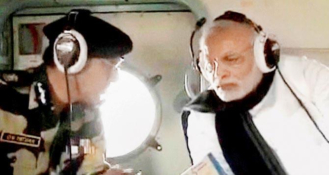 Prime Minister Narendra Modi during an aerial survey of Pathankot Airbase on Saturday to take stock of the situation after it was attacked by terrorists a week ago. pic/pti