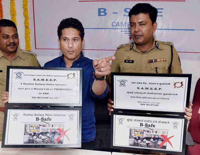 Cricket legend Sachin Tendulkar and Railway police commissioner Madhukar Pandey during the launch of a safety campaign for railway commuters, in Mumbai on Wednesday. PTI