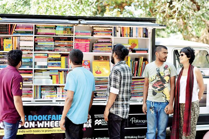 Satabdi Misra (right) and Akshaya Rautaray (second, right) with the Walking Bookfairs Book Truck in Kerala. They arrive in Mumbai later this month