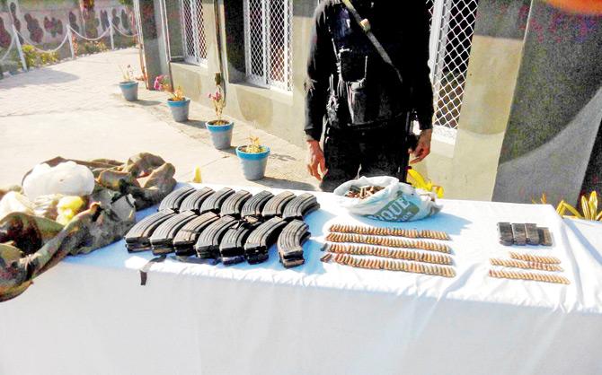 Soldiers display the bullets and other material recovered from the terrorists. PIC/PTI