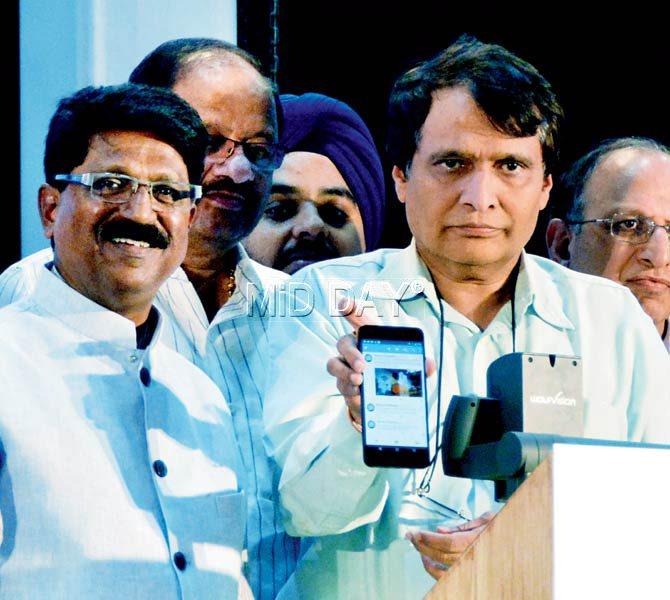 Railway Minister Suresh Prabhu launches the app. MP Arvind Sawant (left) looks on. Pics/Sayyed Sameer Abedi