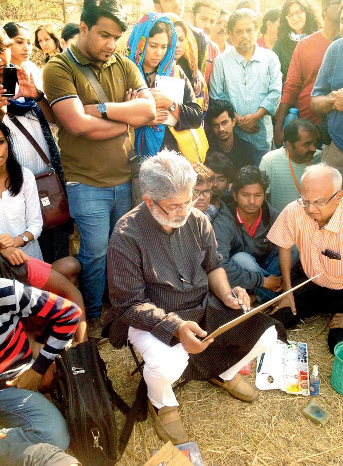 Renowned painter Vasudev Kamat conducts a water-colour demonstration for city-based art students at Girale village. He painted a scene of bullocks being put to work to draw water, for which he drew inspiration from his surroundings 