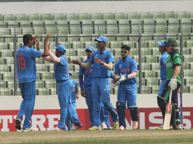Indian u-19 team celebrating the fall of a Irish wicket