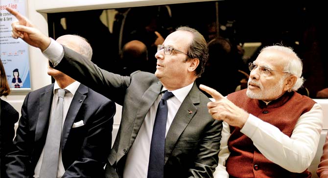 Jet set go: French President Francois Hollande and PM Narendra Modi travel by Metro to Gurgaon to attend an event yesterday. Pic/PTI