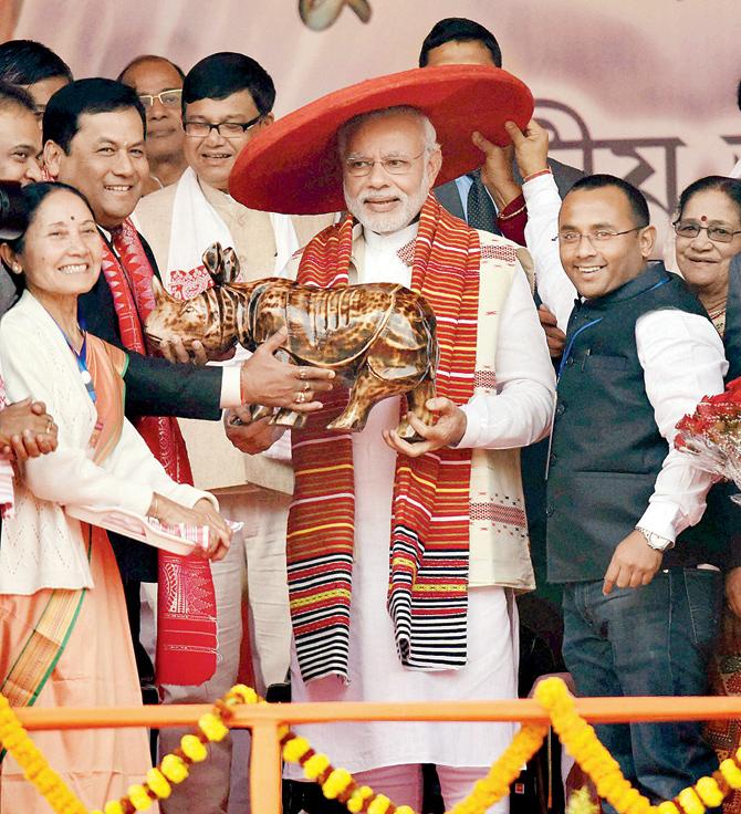 Prime Minister Narendra Modi was presented the traditional Assamese Japi (hat) and Gamocha in Guwahati yesterday. pic/pti 