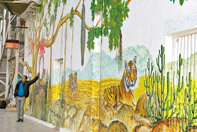 Sections of a painted wall on one of the platforms at Sawai Madhopur railway station. Pic/Aditya 