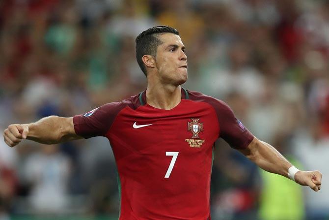 Portugal captain Cristiano Ronaldo celebrates after scoring a penalty against Poland. Pic/ AFP