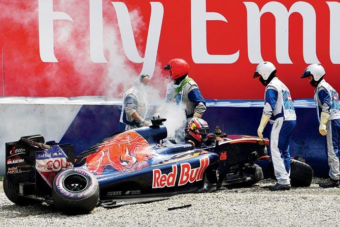 Stewards attend Toro Rosso’s Daniil Kvyat after his crash during the Austrian GP qualifying in Spielberg on Saturday. Pic/AFP
