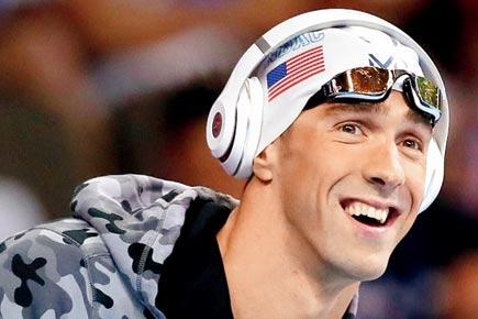 Michael Phelps holds off Lochte in 200m medley thriller as both qualify