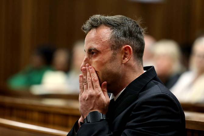 South African Paralympian Oscar Pistorius crying in Pretoria High Court. Pic/ AFP