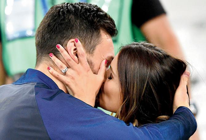 France forward Olivier Giroud kisses his wife Jennifer after the hosts beat Germany 2-0 in the Euro 2016  semi-final on Thursday