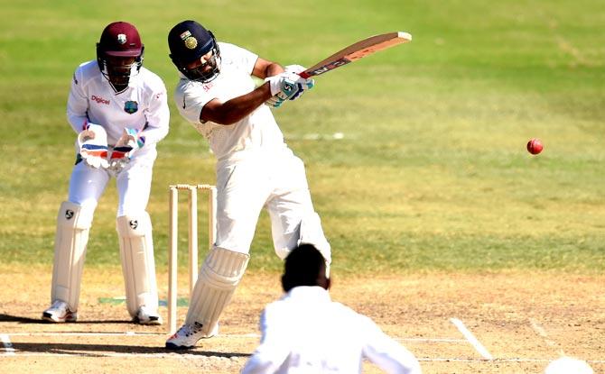 Indian cricketer Rohit Sharma plays a shot during the two-day tour match between India and WICB President