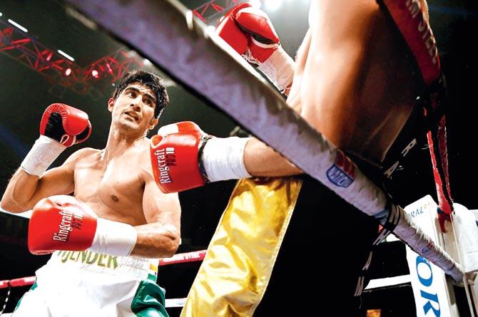 Vijender Singh in a bout against Sonny Whiting of Great Britain during their International Middleweight contest at Manchester Arena on October 10, 2015, in England. In 2013, Singh was in the thick of a controversy, when the police claimed that his car was spotted outside a drug smuggler