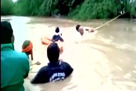 Watch video: 3 rescued, car submerged from overflowing drain in Amravati