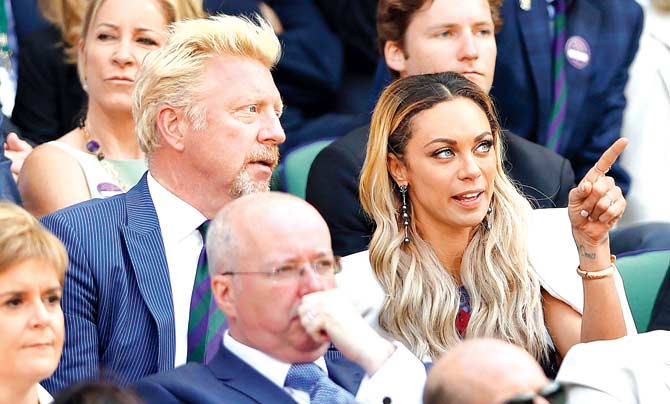 Tennis ace Boris Becker and his model wife Lilly soak in the action