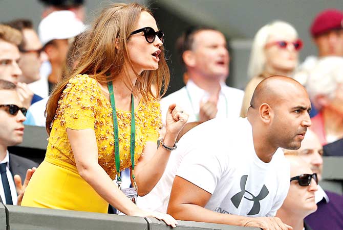 Kim Sears cheers husband Andy Murray during the final against Milos Raonic. Murray
