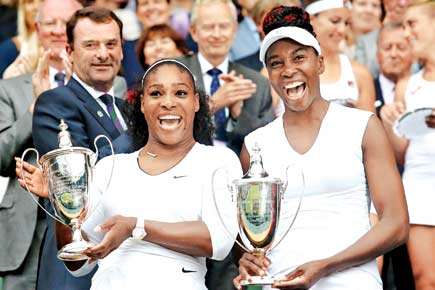Wimbledon: Williams sisters rule women's doubles