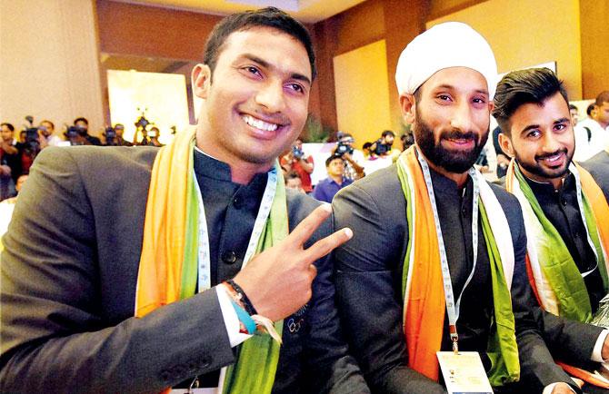 India hockey players V Raghunath (left), Sardar Singh and Manpreet Singh (right) at a function in New Delhi yesterday. Pic/PTI