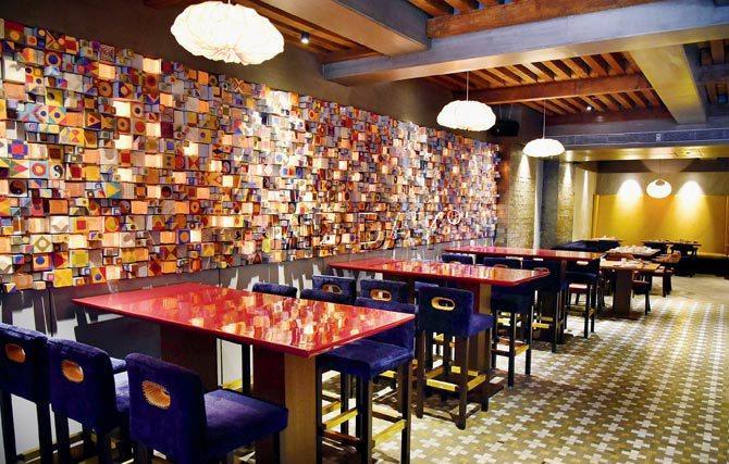 The chic interiors, which feature a wall of wooden blocks painted with eclectic, geometric designs, have been designed by Sumessh Menon and his team of architects