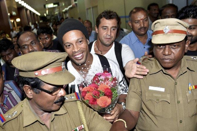 Ronaldinho arrives at Chennai Airport to participate in "Premier Futsal League 2016". Pic/ AFP