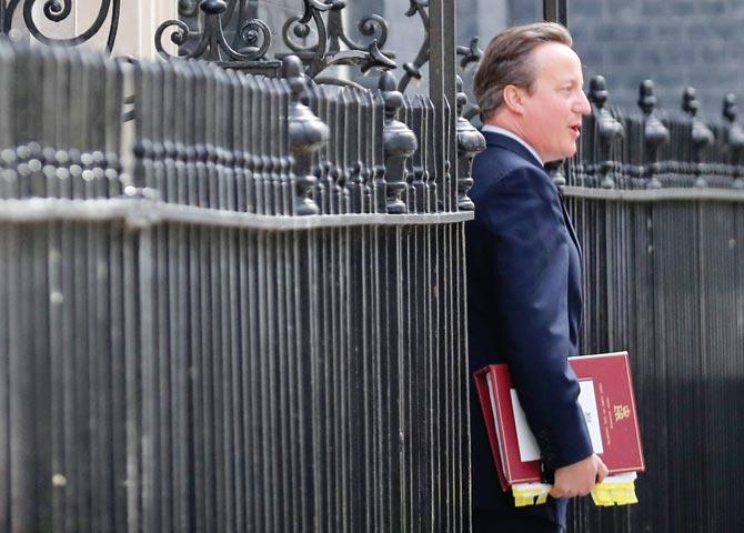 Outgoing Prime Minister David Cameron leaves 10 Downing Street to attend his final session of Prime Minister’s Questions at the House of Commons yesterday in London. Pic/Getty Images