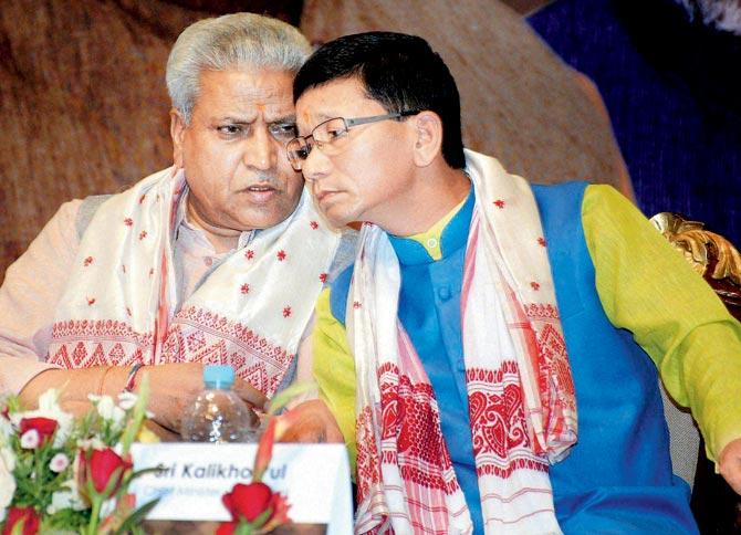 In hushed tones: Arunachal Pradesh Chief Minister Kalikho Pul and BJP leader Ram Lal during the inaugural conclave of North East Democratic Alliance (NEDA) in Guwahati yesterday. pic/PTi