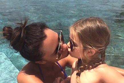 Victoria Beckham under fire for kissing daughter on the lips