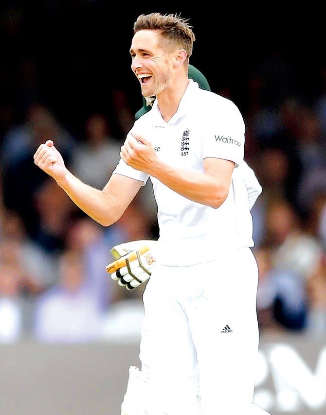 Chris Woakes celebrates the wicket of Pakistan