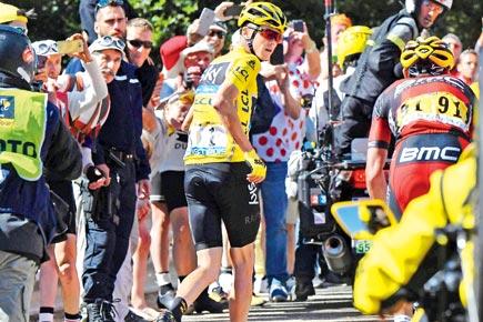 Tour de France: Christopher Froome retains yellow jersey despite bike crash