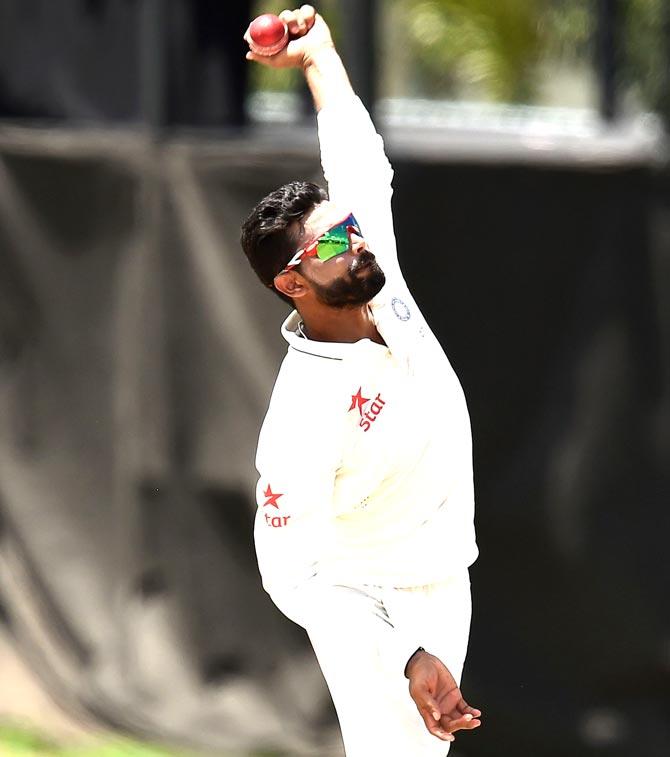 Indian cricketer Ravindra Jadeja delivers a ball during the three-day tour match between India and WICB President
