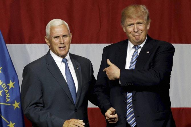 Indiana Gov. Mike Pence with Republican presidential candidate Donald Trump. Pic/ PTI