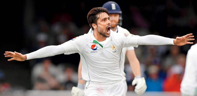 Pakistan bowler Mohammad Amir celebrates after dismissing England captain Alastair Cook during Day Two of the first Test against Pakistan at Lord’s Cricket Ground yesterday.  PIC/Getty Images 