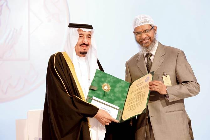 A picture released by the King Faisal Foundation in March 2015 shows Saudi King Salman bin Abdul Aziz presenting Zakir Naik, with the 2015 King Faisal International Prize for Service to Islam in Riyadh. Pic/AFP