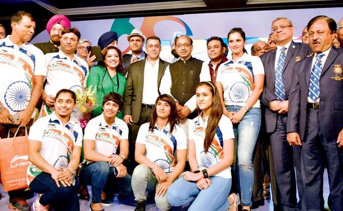 Indian athletes (sitting, left to right) gymnast Dipa Karmakar, wrestlers Babita Kumari, and Vinesh Phogat, TT player Manika Batra with Sania Mirza (standing), actor Salman Khan, Sports Minister Vijay Goel and music composer AR Rahman (to Sania’s right) during a send-off ceremony in New Delhi yesterday. Pic/PTI