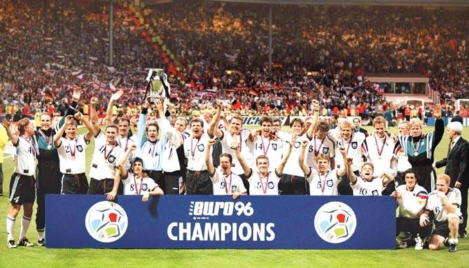 June 30, 1996: Members of the German team pose with the trophy after the Euro 1996 final against Czech Republic at Wembley in London. Germany won 2-1. Pic/Getty Images