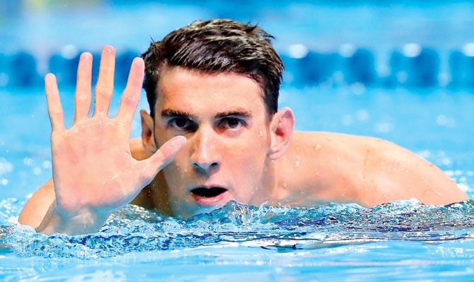 Michael Phelps reacts after qualifying for his fifth Olympics