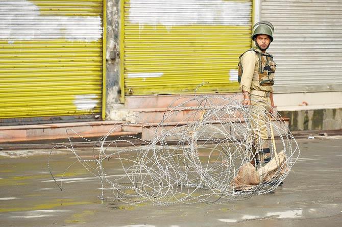 Kashmir remains in the grip of tight curfew and communication blockade following civilian deaths in the days after Burhan Wani’s killing. Pic/AFP