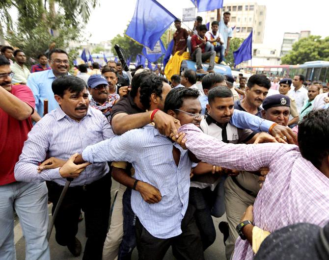 Ahmedabad: Police detain members of Dalit Community who were staging a protest in Ahmedabad on Tuesday against the assault on dalit members by cow protectors in Rajkot district, Gujarat. 