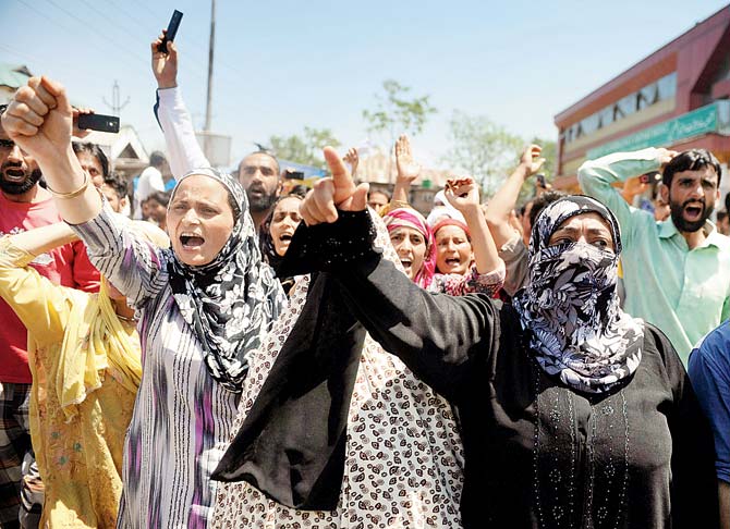 Kashmiri protestors shout pro-freedom and anti-Indian slogans outside a hospital during a rally in Srinagar yesterday, against a state government order of the eviction of voluntary organisations from hospitals. Pic/AFP